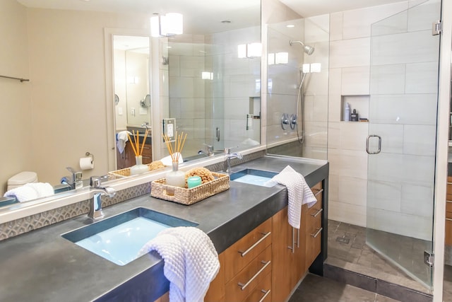 bathroom featuring vanity and a shower with shower door