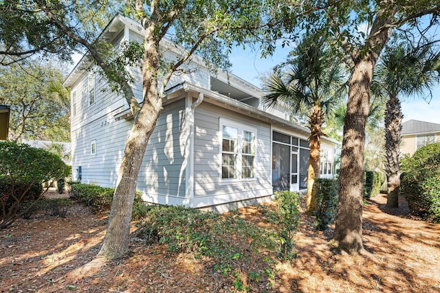 back of property featuring a sunroom