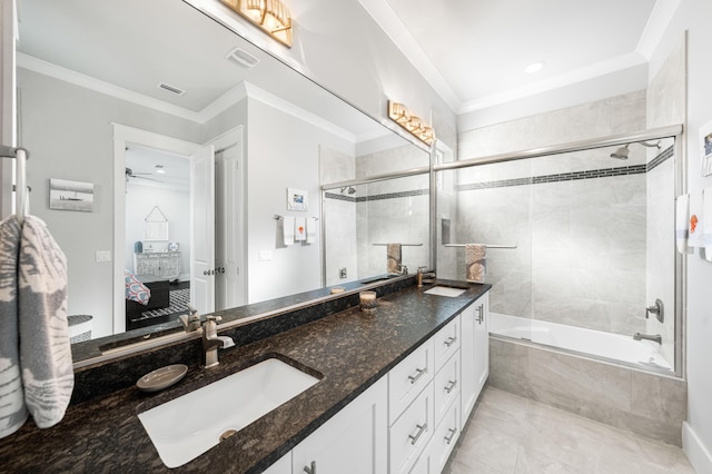 bathroom with ornamental molding, combined bath / shower with glass door, and vanity