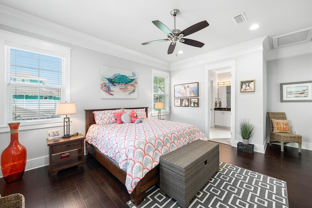 bedroom with ceiling fan, ornamental molding, dark hardwood / wood-style flooring, and connected bathroom