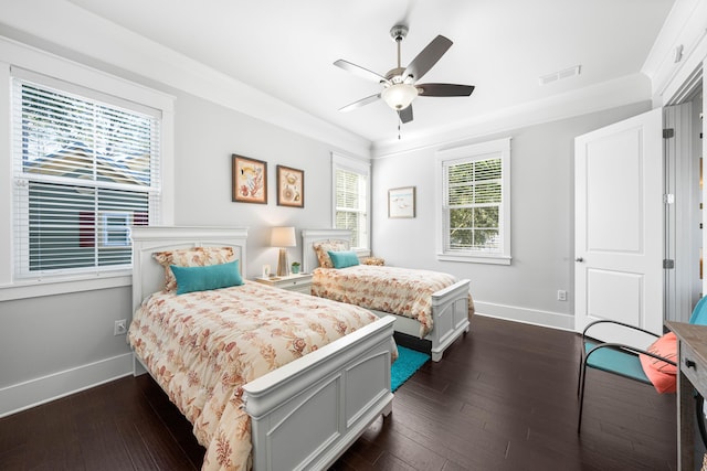 bedroom featuring crown molding, ceiling fan, and dark hardwood / wood-style flooring