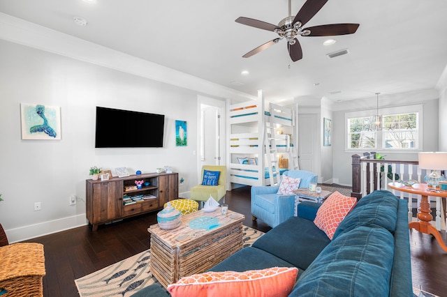 living room with crown molding and dark hardwood / wood-style flooring