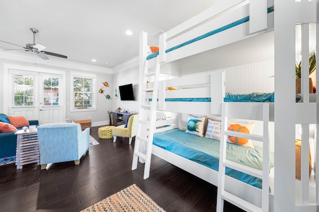 bedroom with dark wood-type flooring and crown molding