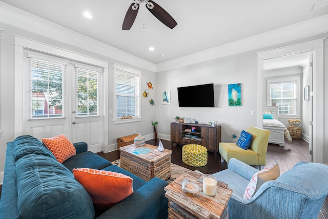 living room featuring crown molding, ceiling fan, hardwood / wood-style floors, and a wealth of natural light