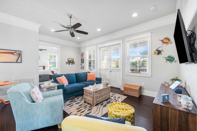 living room with ceiling fan, crown molding, and dark hardwood / wood-style flooring