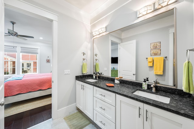 bathroom with vanity, tile patterned flooring, crown molding, and ceiling fan