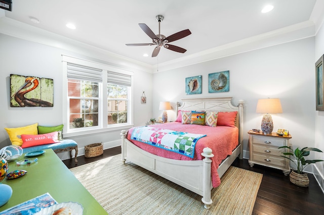 bedroom featuring ornamental molding, ceiling fan, and dark hardwood / wood-style flooring