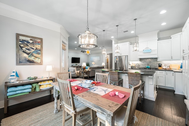 dining room with dark hardwood / wood-style flooring