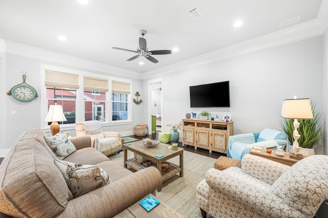 living room featuring wood-type flooring and ceiling fan