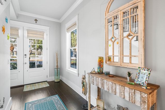 entryway with dark hardwood / wood-style flooring, crown molding, and french doors