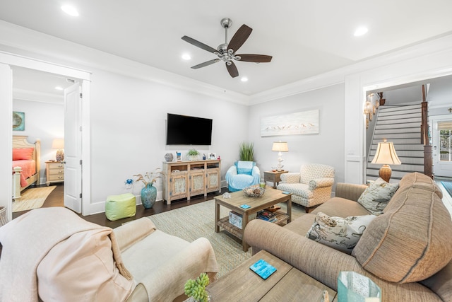 living room with ceiling fan, ornamental molding, and wood-type flooring