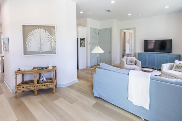 living room with light hardwood / wood-style floors