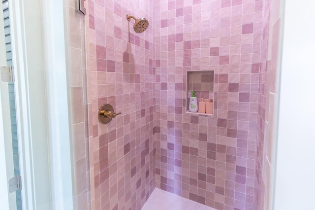 bathroom with tiled shower