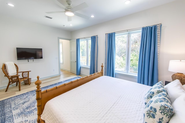 bedroom with hardwood / wood-style flooring and ceiling fan