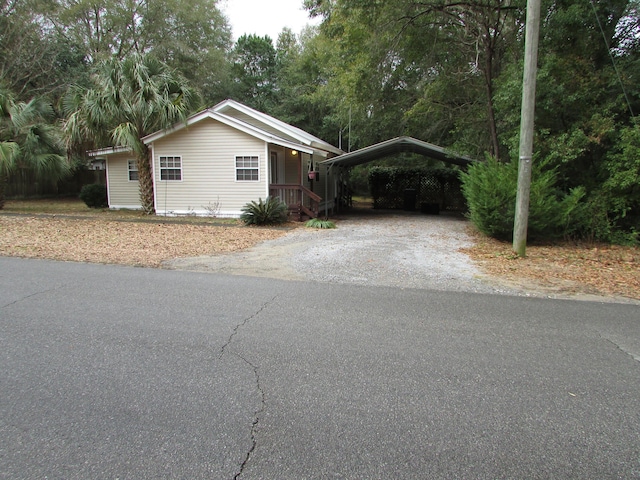 view of side of property with a carport