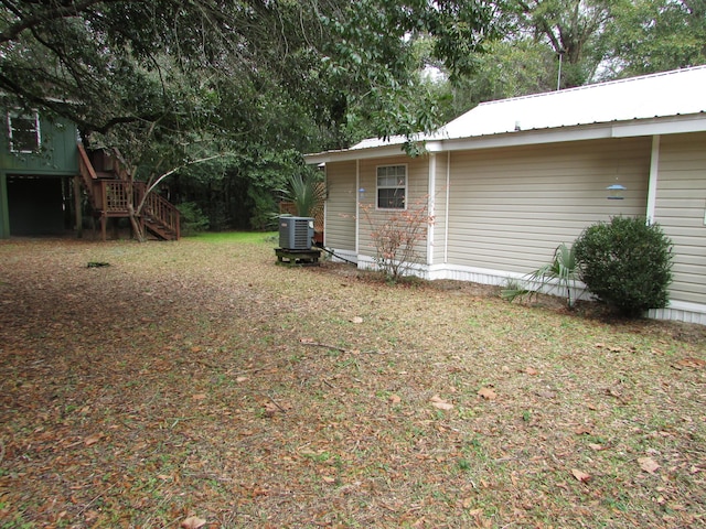 view of yard with central air condition unit