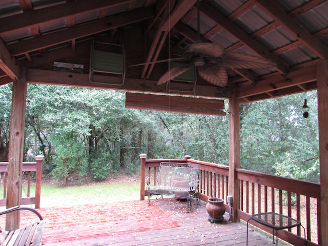 wooden terrace with a gazebo and ceiling fan