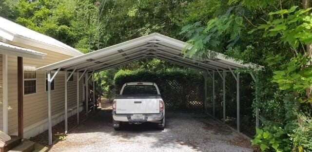 view of vehicle parking featuring a carport