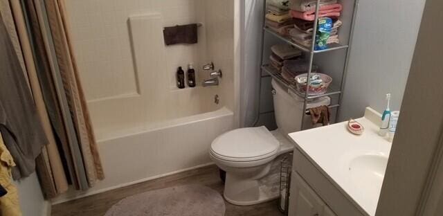 full bathroom featuring vanity, shower / bath combination with curtain, and toilet