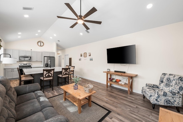 living room featuring ceiling fan, wood-type flooring, and high vaulted ceiling