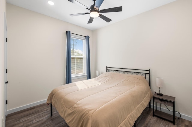 bedroom with dark wood-type flooring and ceiling fan