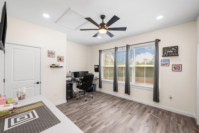 office with hardwood / wood-style flooring and ceiling fan