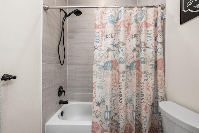 bathroom with shower / tub combo with curtain and toilet