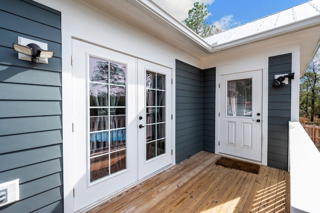 entrance to property with a wooden deck and french doors