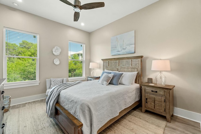 bedroom featuring light hardwood / wood-style floors and ceiling fan