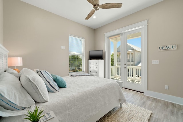 bedroom featuring access to exterior, ceiling fan, and light hardwood / wood-style flooring