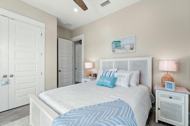 bedroom featuring wood-type flooring and ceiling fan