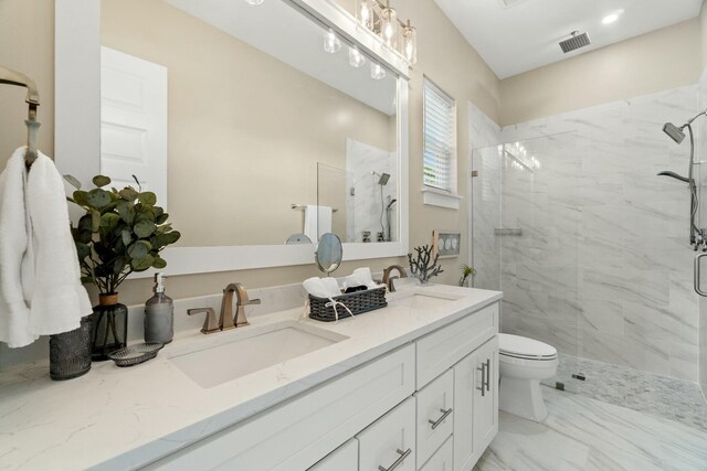 bathroom featuring walk in shower, vanity, and toilet