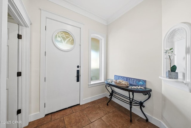 tiled foyer entrance with crown molding