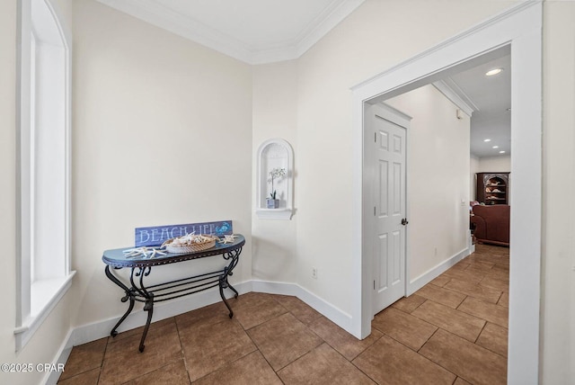 hallway featuring ornamental molding