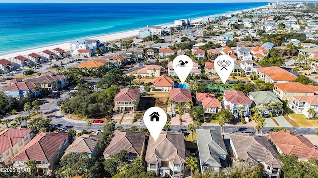 bird's eye view featuring a water view and a beach view