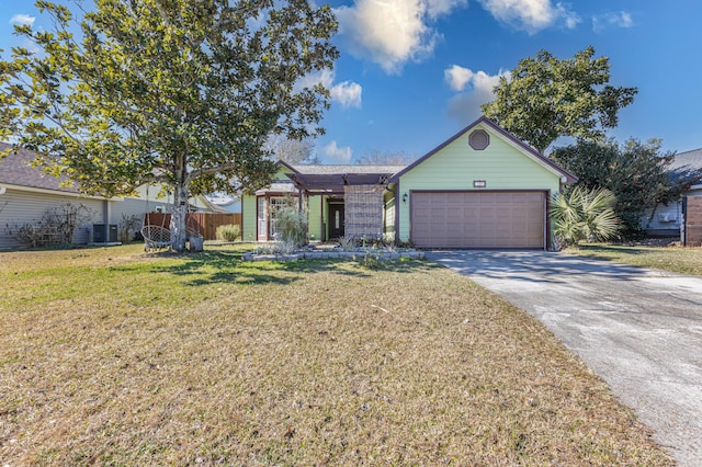 single story home with central AC unit, a garage, and a front yard