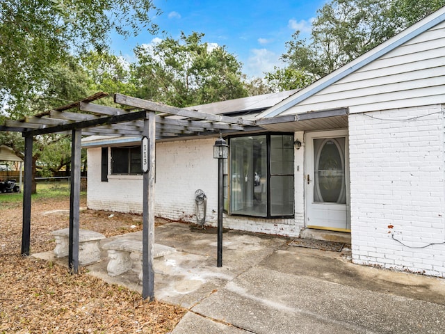 property entrance with a patio area