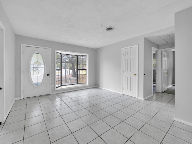 foyer entrance featuring light tile patterned floors