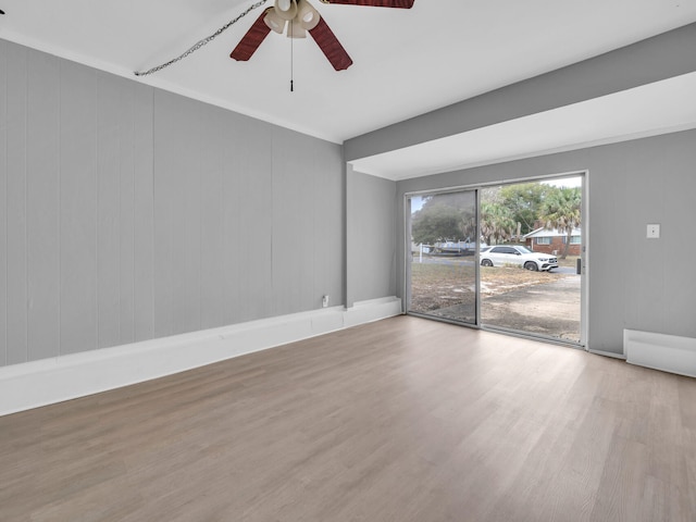 spare room with hardwood / wood-style flooring and ceiling fan