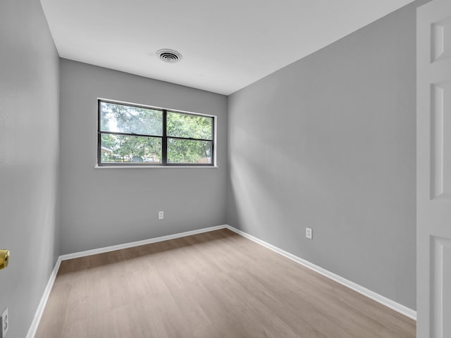 spare room featuring light hardwood / wood-style floors