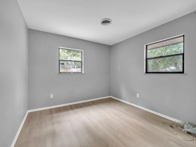 empty room with light wood-type flooring