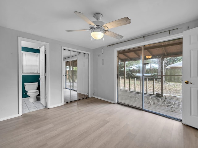 spare room featuring ceiling fan and light hardwood / wood-style floors