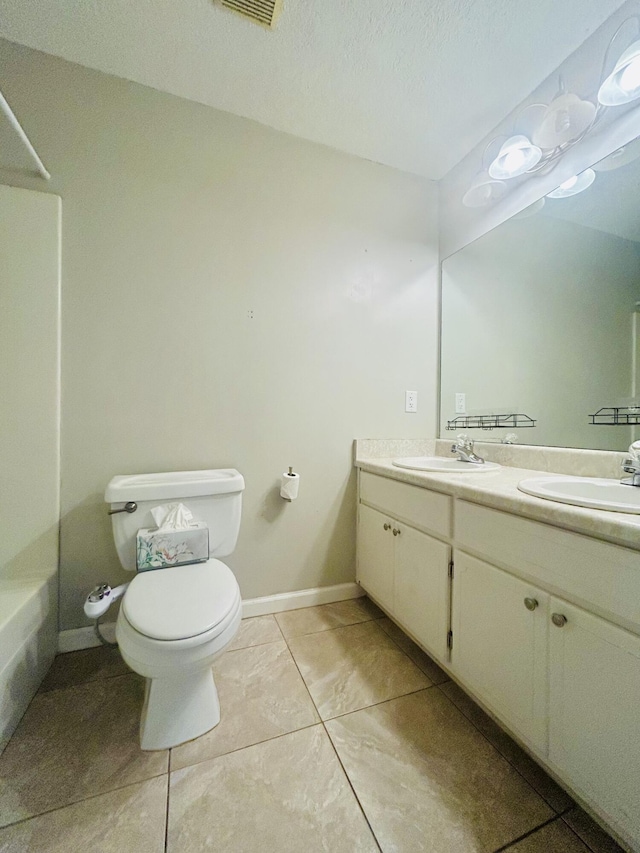545 J H Crews Cir, Panama City, FL 32404 - bathroom featuring tile patterned floors, a sink, double vanity, and toilet