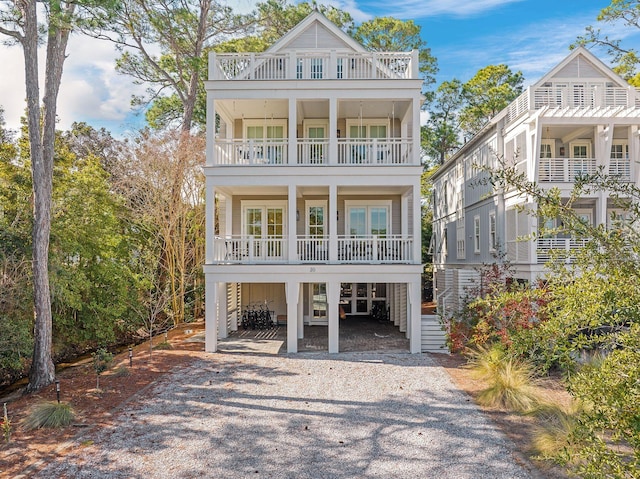 view of front of home featuring a carport and a balcony