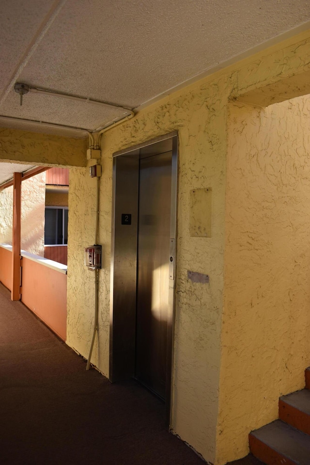 hallway featuring elevator