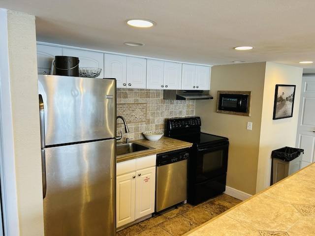 kitchen with sink, white cabinetry, stainless steel appliances, tasteful backsplash, and tile countertops