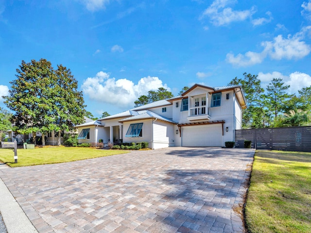 view of front of property with a garage and a front yard