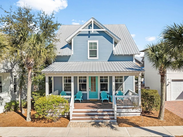 view of front of home featuring a garage and a porch