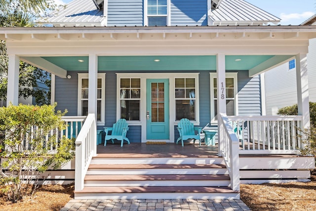 entrance to property featuring a porch