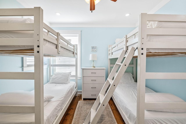 bedroom with ceiling fan and dark hardwood / wood-style flooring